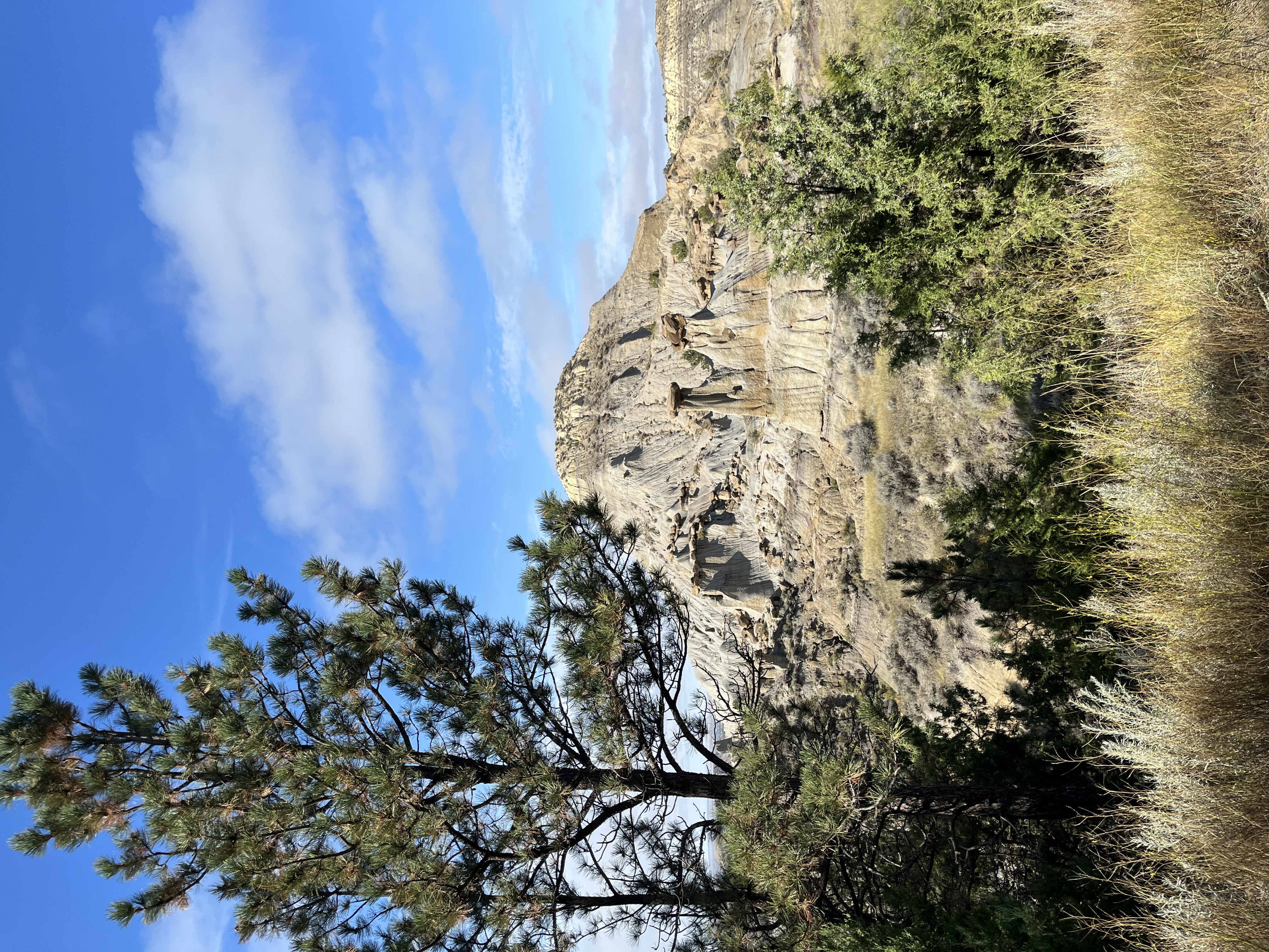 A rock formation against a blue sky in Makoshika State Park