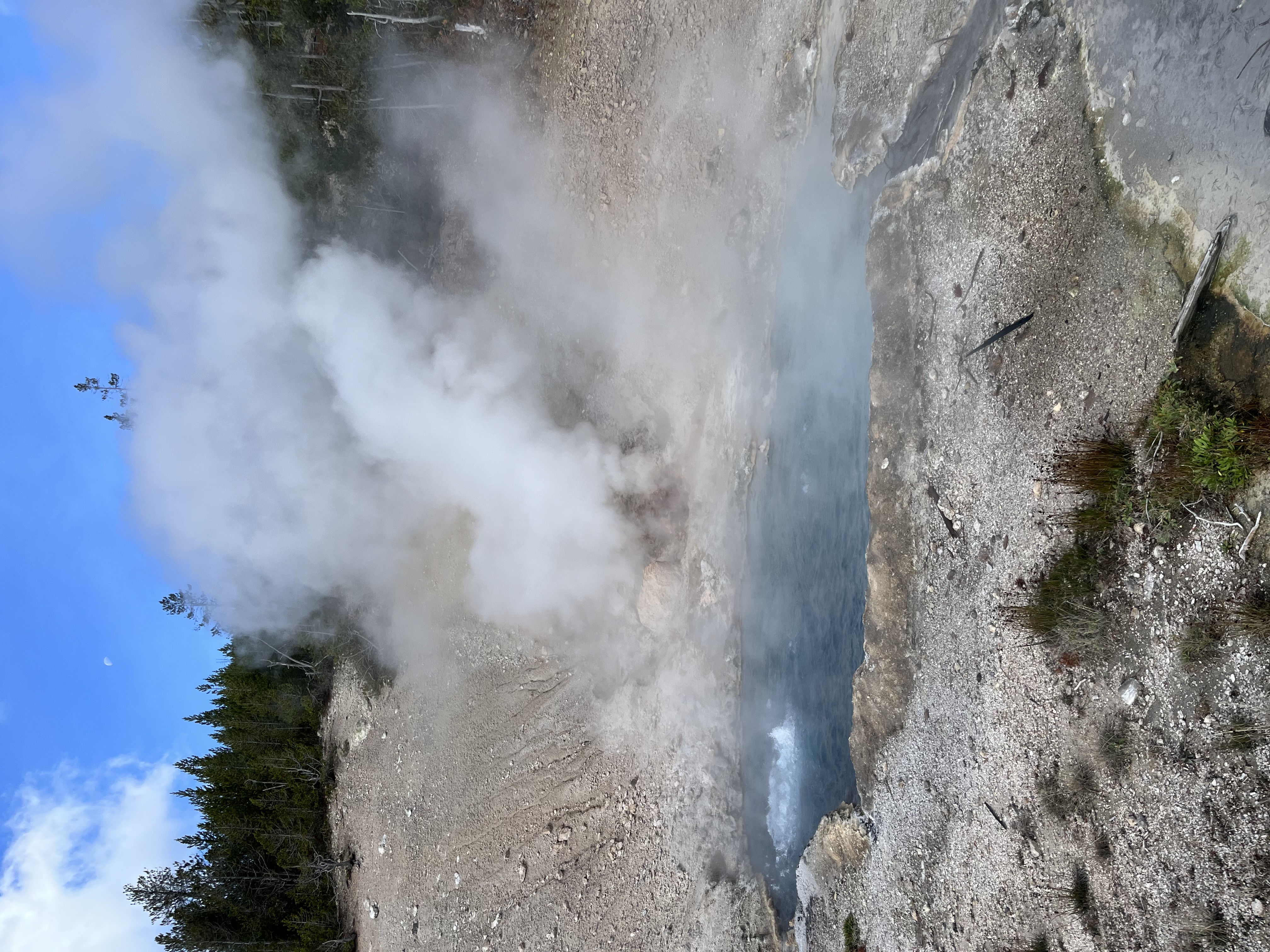 A pool of water that's steaming and, in some places, boiling