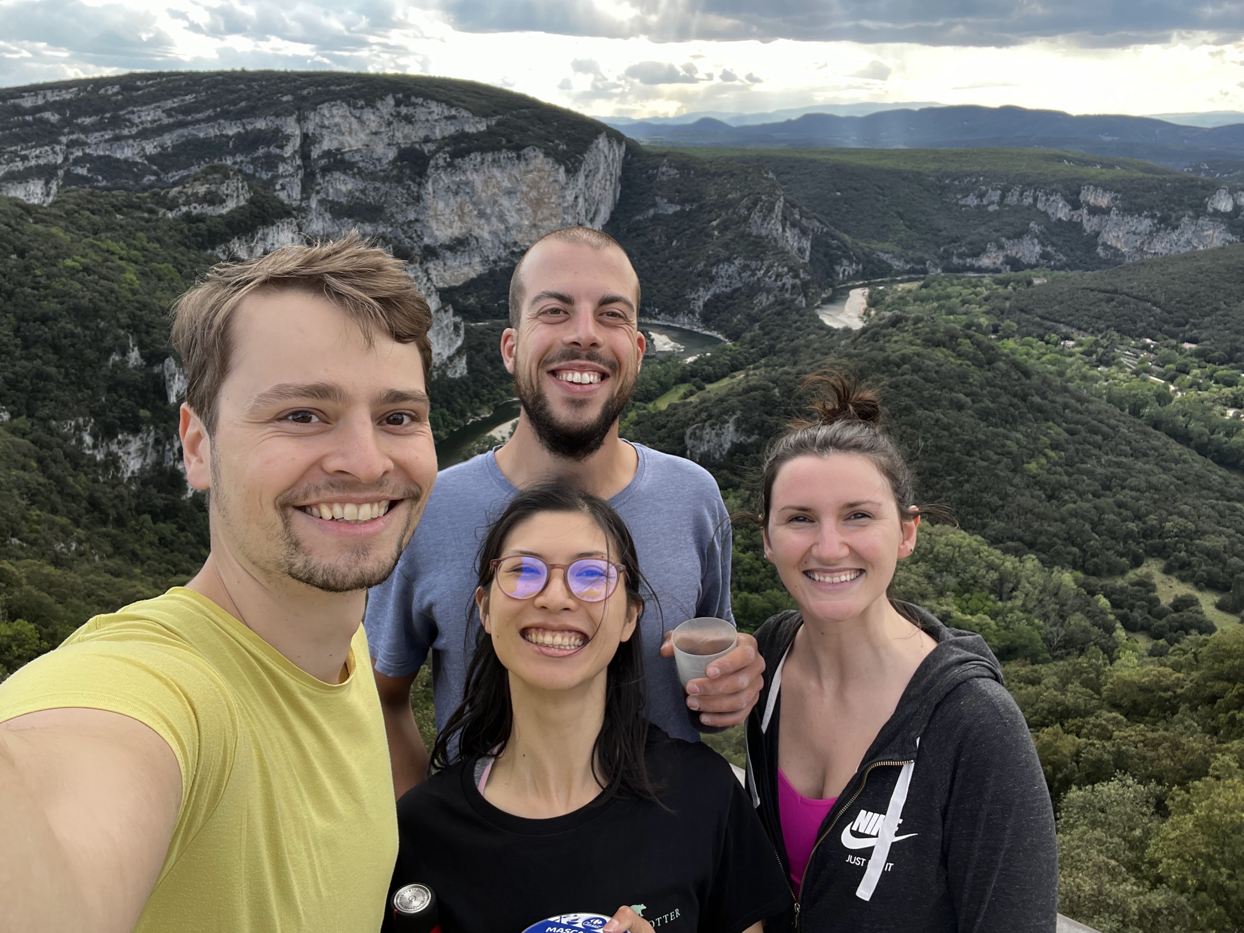 A picture of Connor, Robin, Clara, and Jillian overlooking a mountainous view